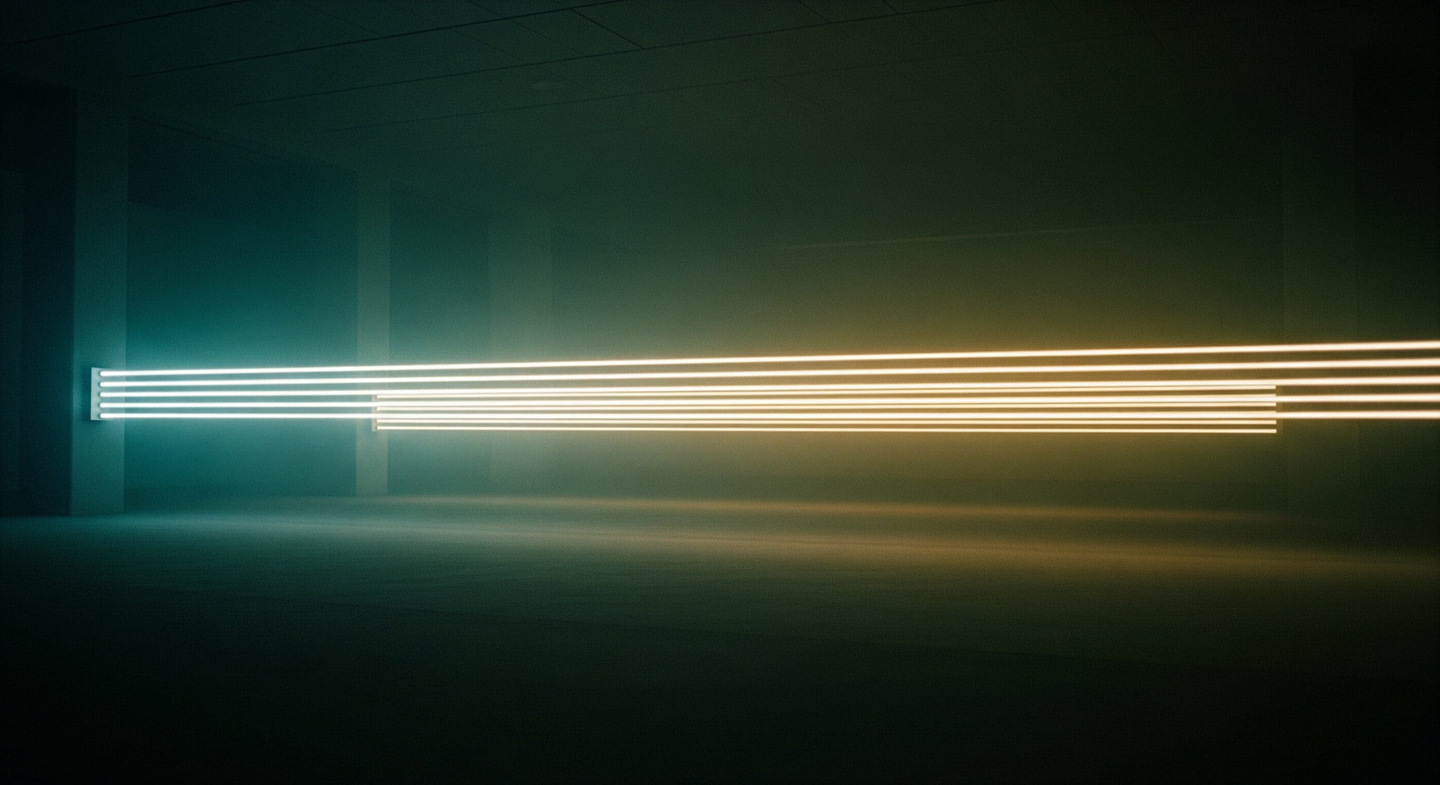 Dark room with horizontal light beams forming parallel lines.
